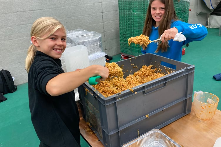 Wellington School students working hard to package 60,000 meals in 24 hours